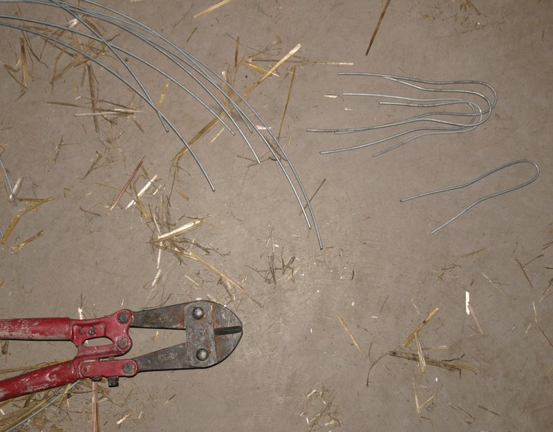 Bale pins made from 12 gauge fencing wire. Note double bend for grip in wall.